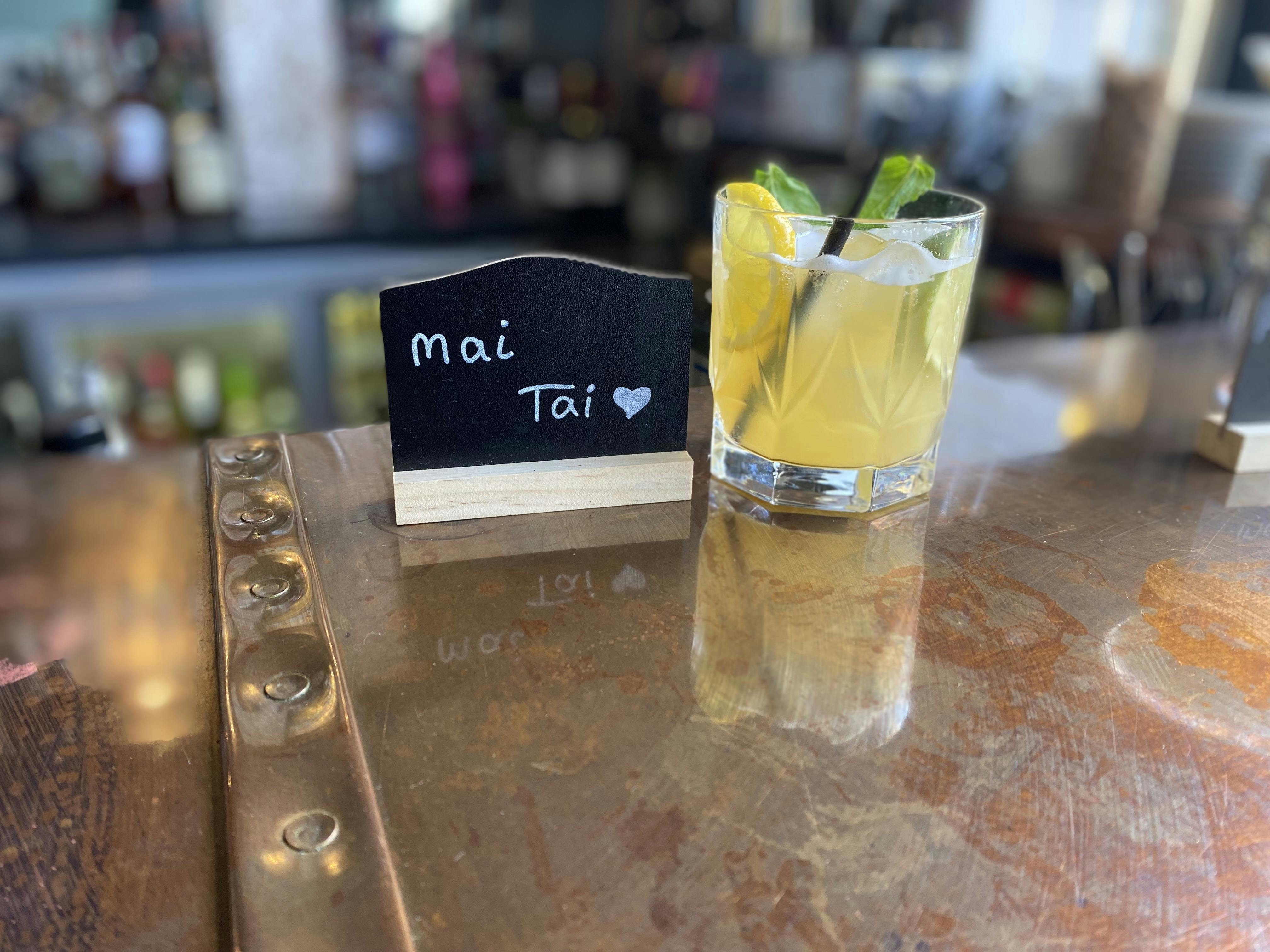 Mai Tai cocktail on polished bar, showcasing upscale event beverage presentation.