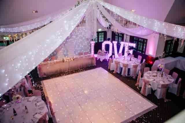 Taylor Suite at Woolston Manor, elegant wedding venue with fairy lights and "LOVE" display.