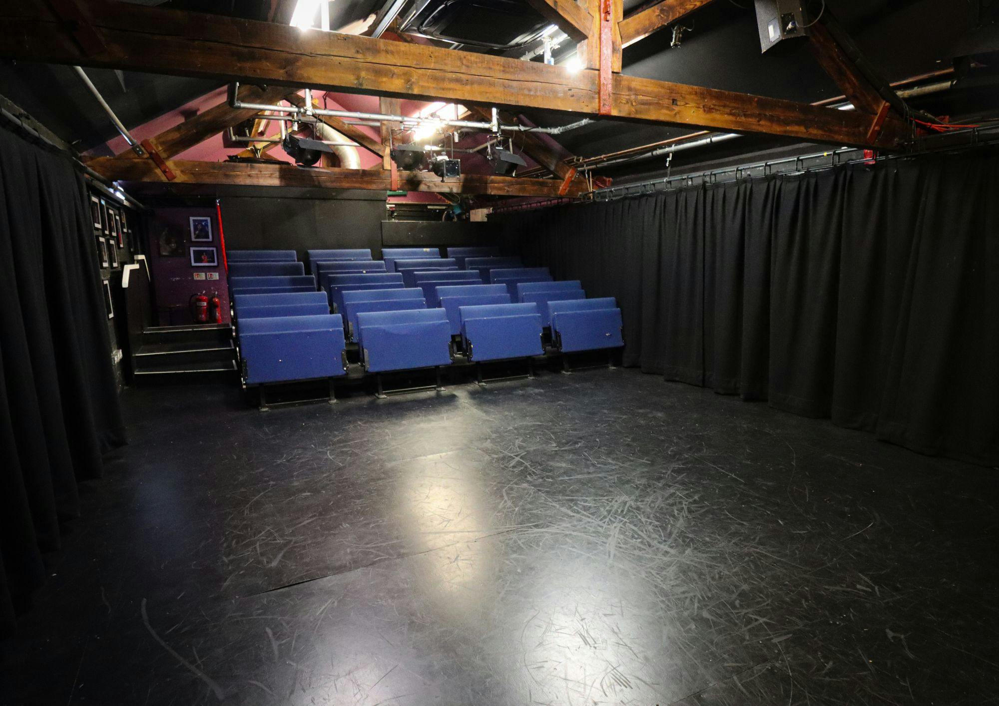 Versatile event space with tiered seating at Pleasance Theatre for workshops and presentations.