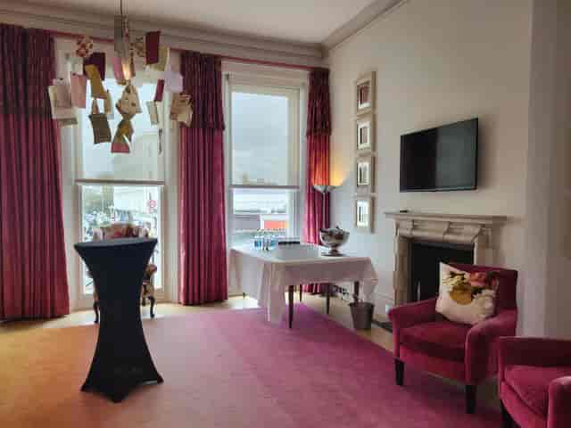 Stylish meeting space at The Pelham Hotel with vibrant curtains for intimate gatherings.