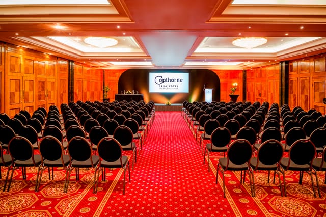 Shannon Suite conference room with black chairs, ideal for corporate events in London.