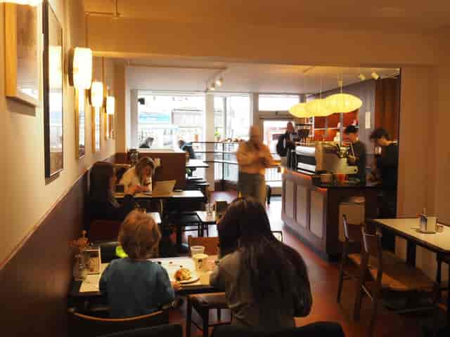 Cozy café with warm lighting, ideal for networking events and informal meetings.
