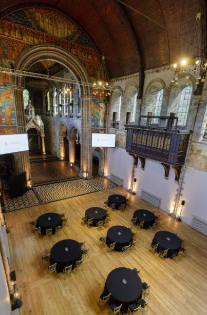 Elegant event space in Mansfield Traquair with high ceilings and stained glass for upscale gatherings.