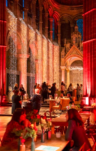 Elegant event space with fairy lights, perfect for networking and social gatherings.