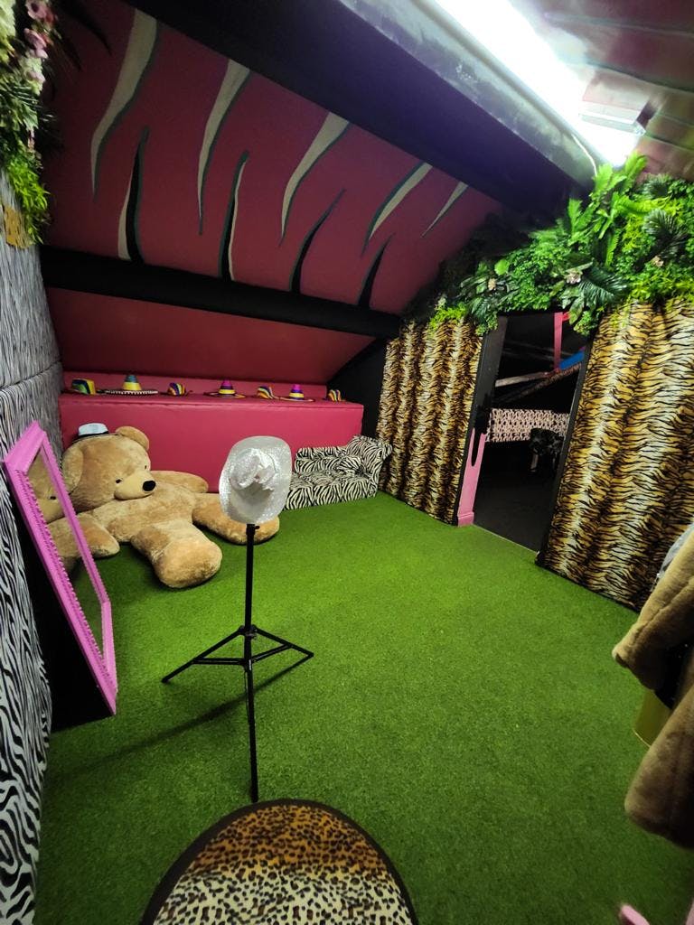 VIP area with oversized teddy bear in BUNA Lounge for themed parties and children's events.