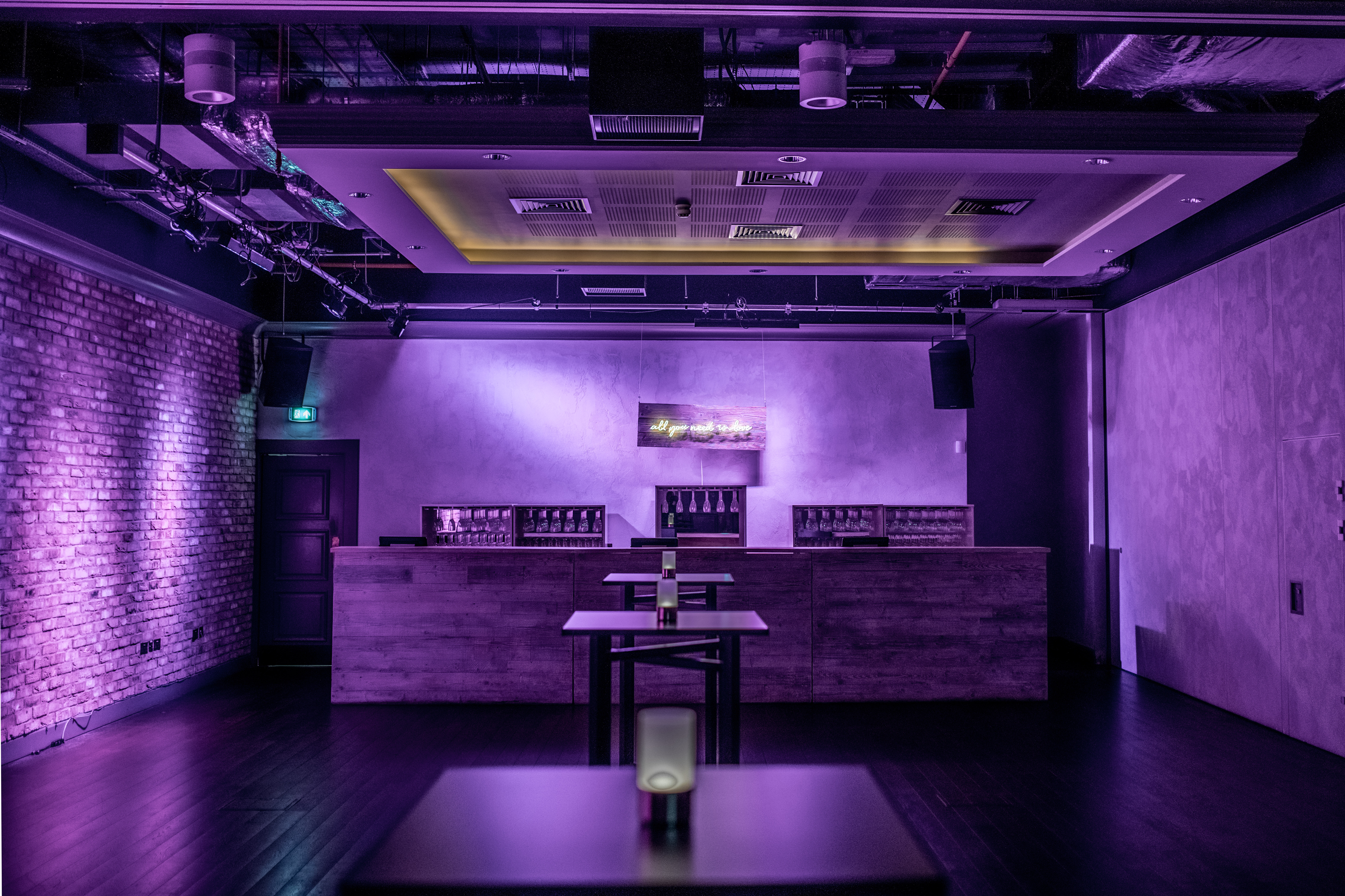 The Ballroom West at Virgin Hotels London: sleek event space with purple lighting. - Banner