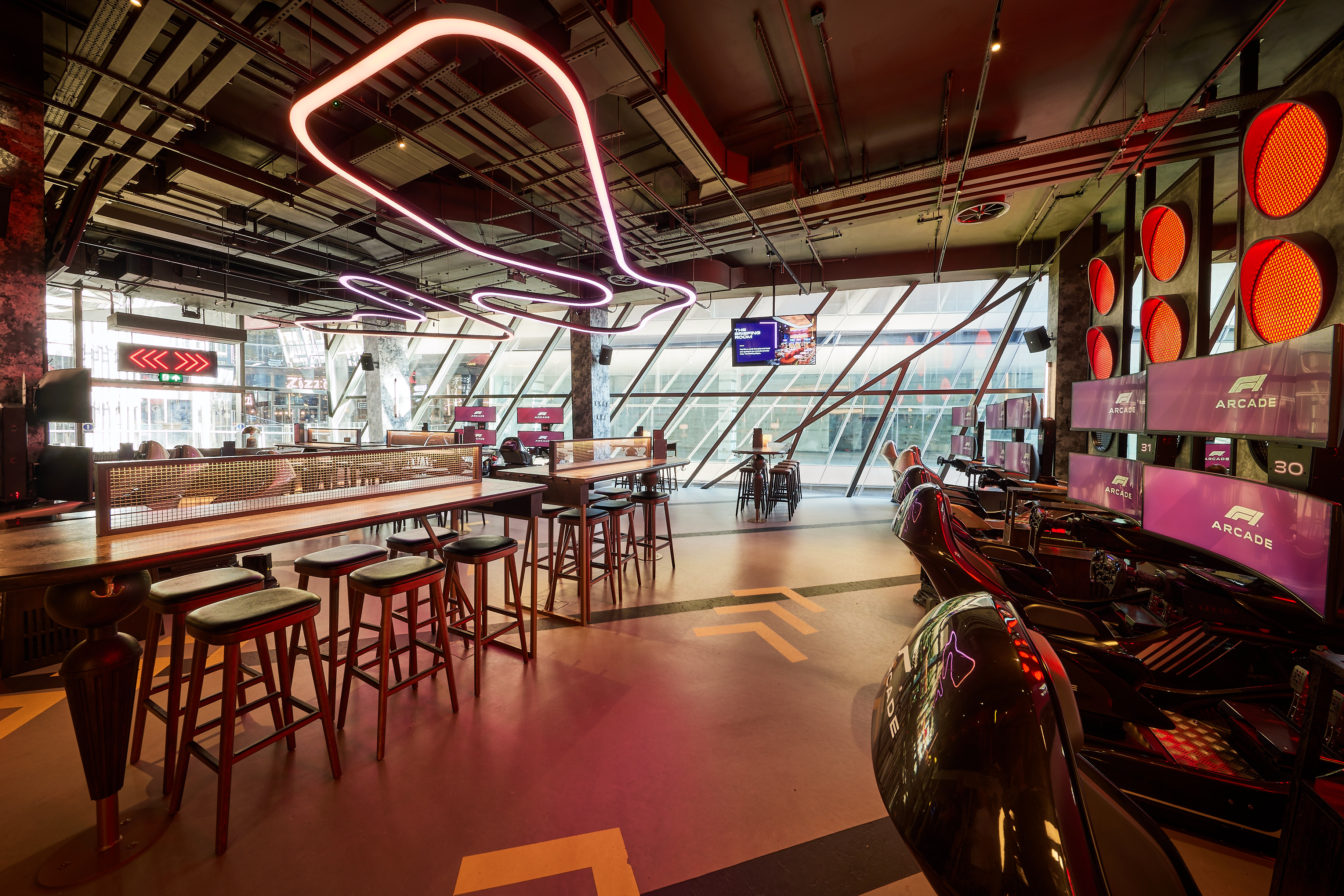 Modern event space P4 in F1 Arcade, ideal for networking and meetings.