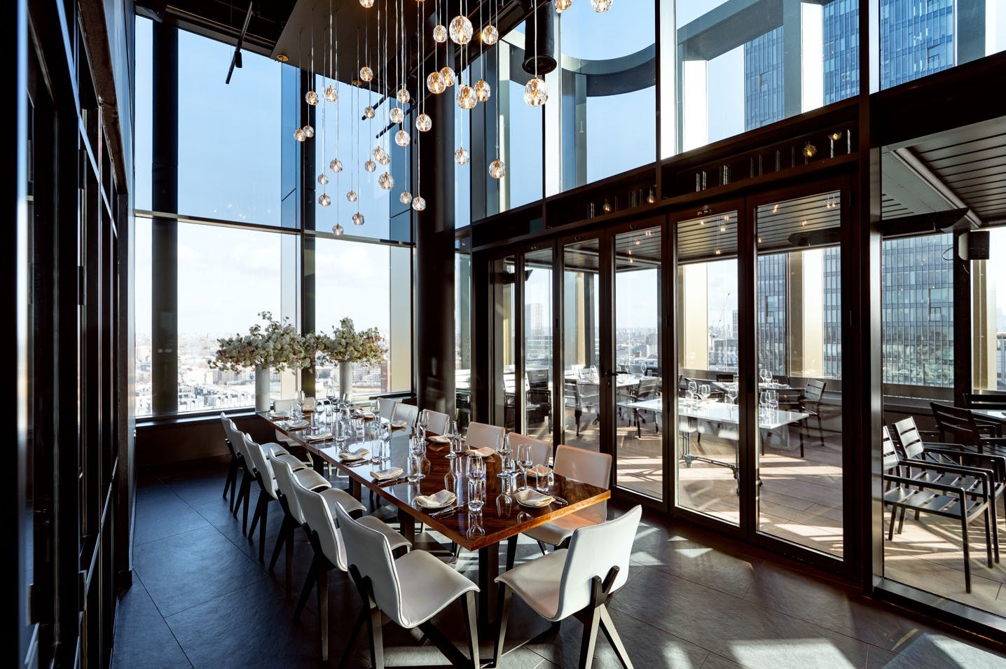 Private dining room at STK Rooftop Stratford with panoramic views for upscale events.