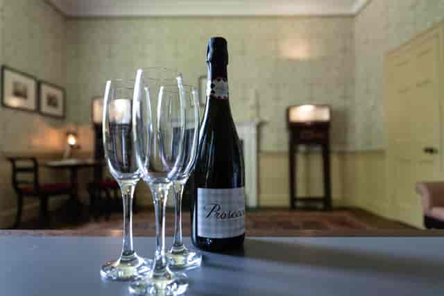 Elegant venue setup with champagne flutes for milestone celebrations and networking events.
