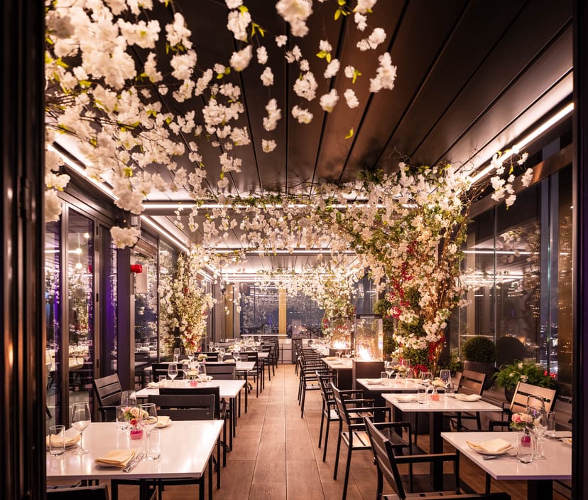 Elegant floral decor in STK Rooftop Stratford's East Terrace event space.