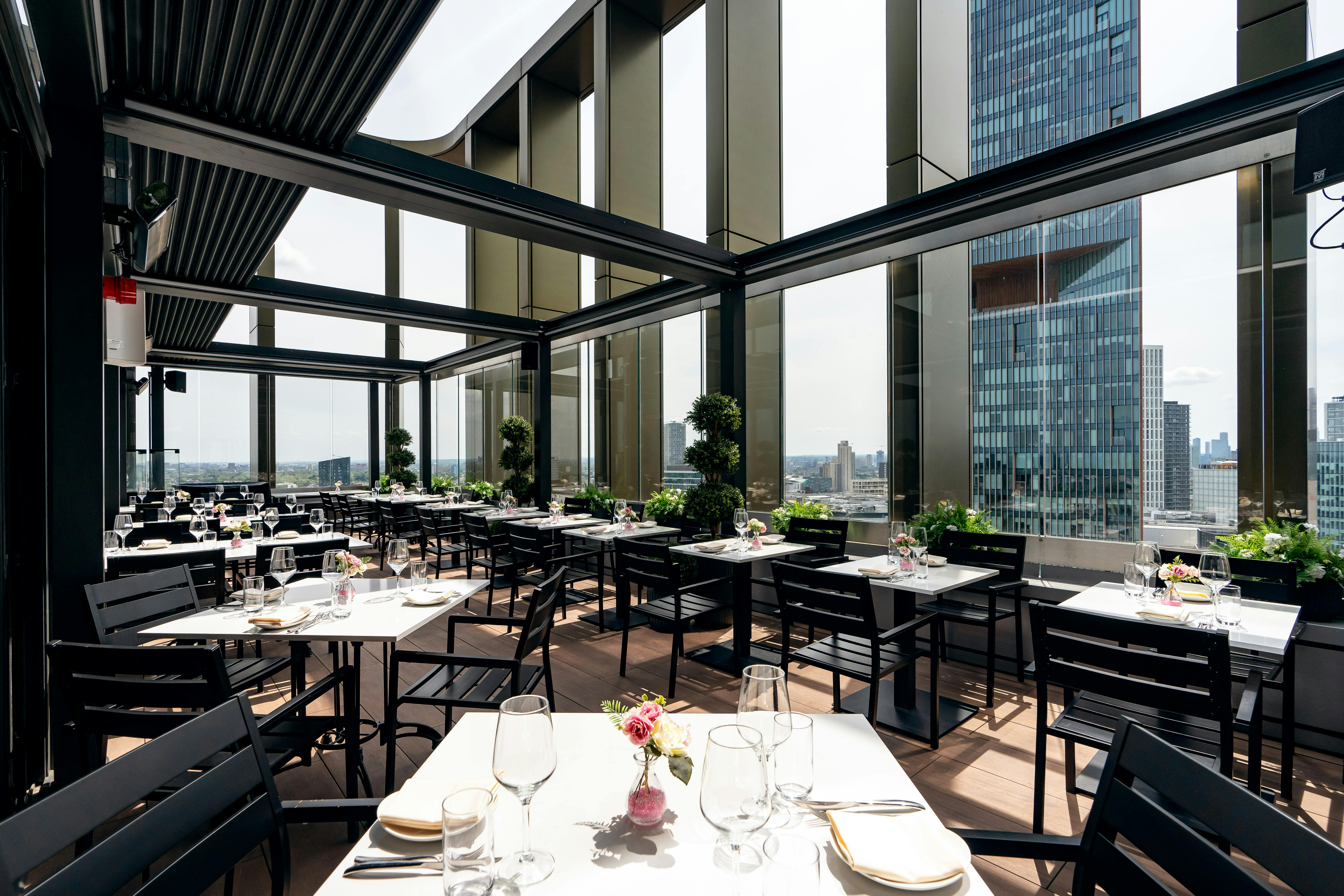 Private dining room terrace at STK Rooftop Stratford, ideal for upscale events and receptions.