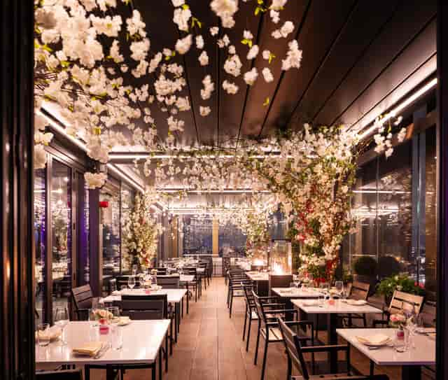 Private dining room at STK Rooftop Stratford with floral decor, ideal for upscale events.