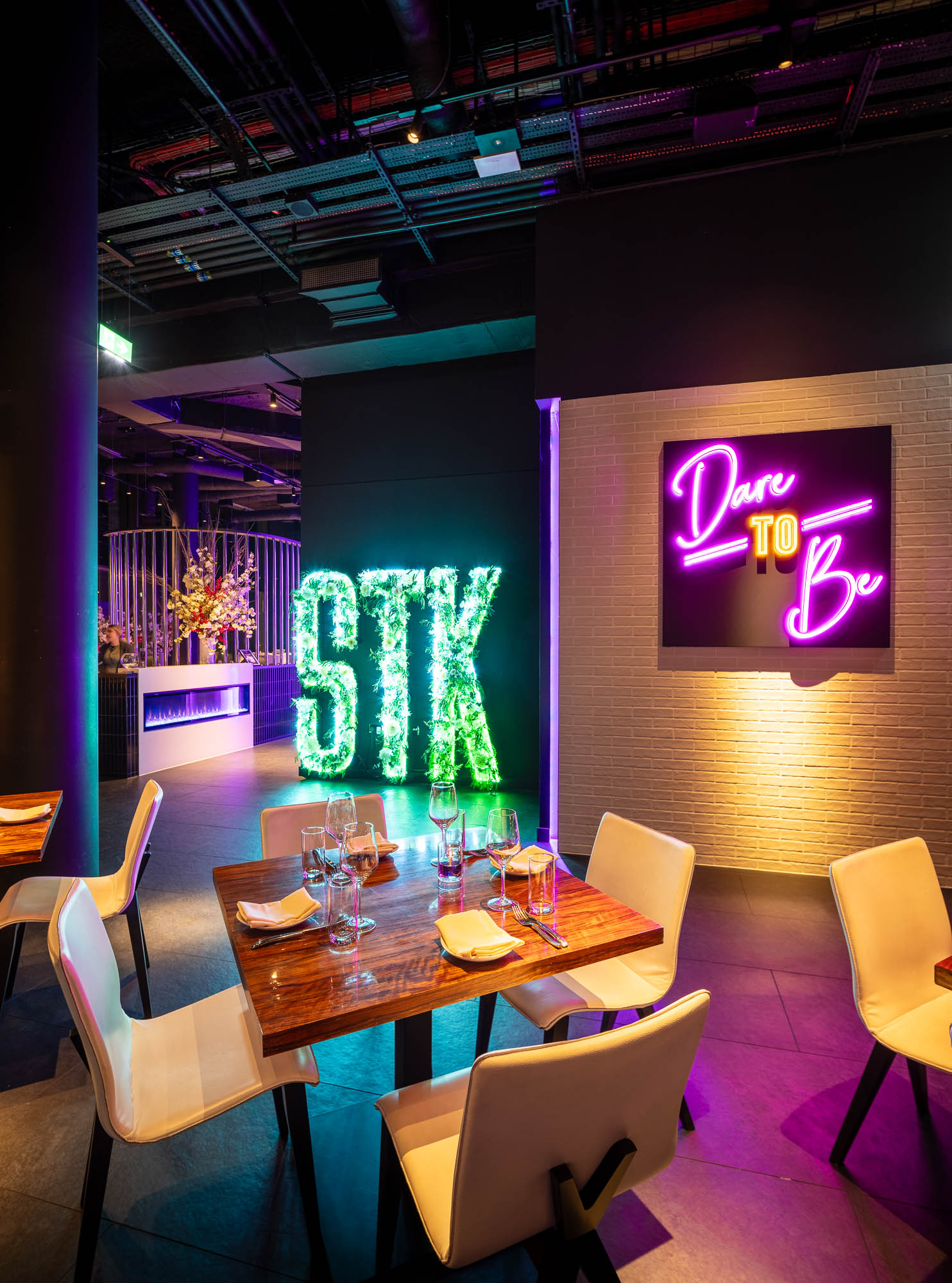 Full Venue at STK Rooftop Stratford, featuring elegant tables for upscale events. - Banner