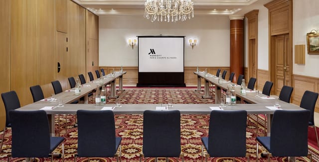Meeting room at Paris Marriott Champs Elysees, U-shaped setup for corporate events.