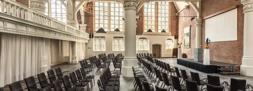 Olof's Chapelle venue with black chairs, ideal for conferences and workshops.