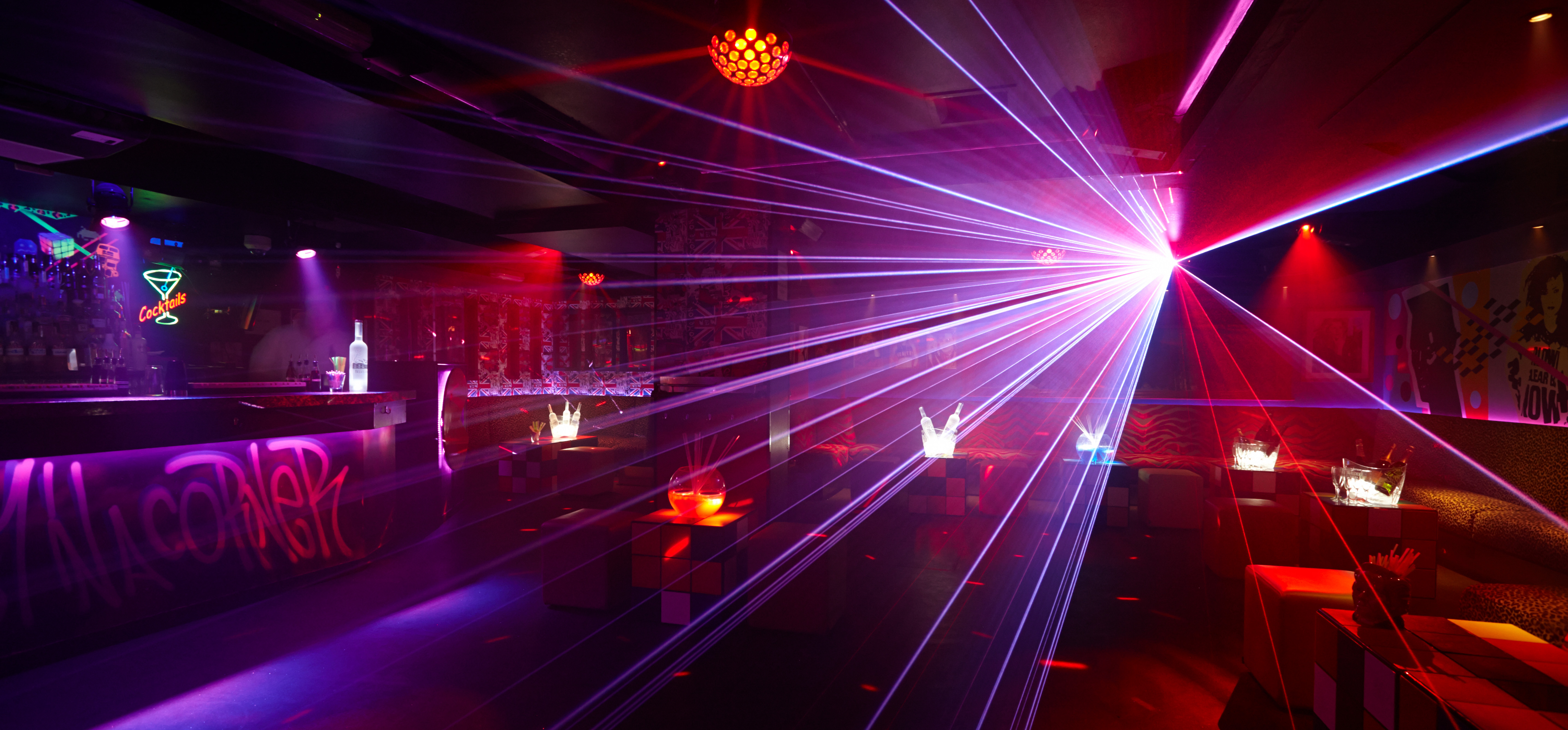 Vibrant event space at Maggie's Whole Venue with dynamic lighting for parties and corporate events. - Banner