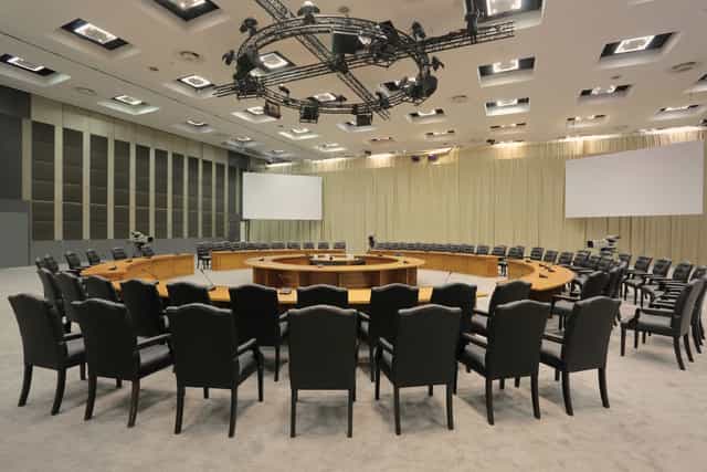 "Sandton Convention Centre conference room with circular table for high-level meetings"