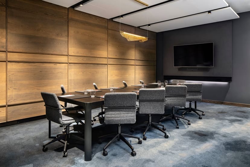 Modern conference room with wooden paneling at Johannesburg Marriott for professional meetings.