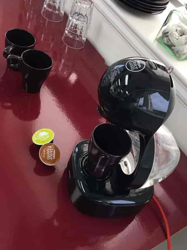 kBone Meeting Room coffee station with sleek maker for events and networking.