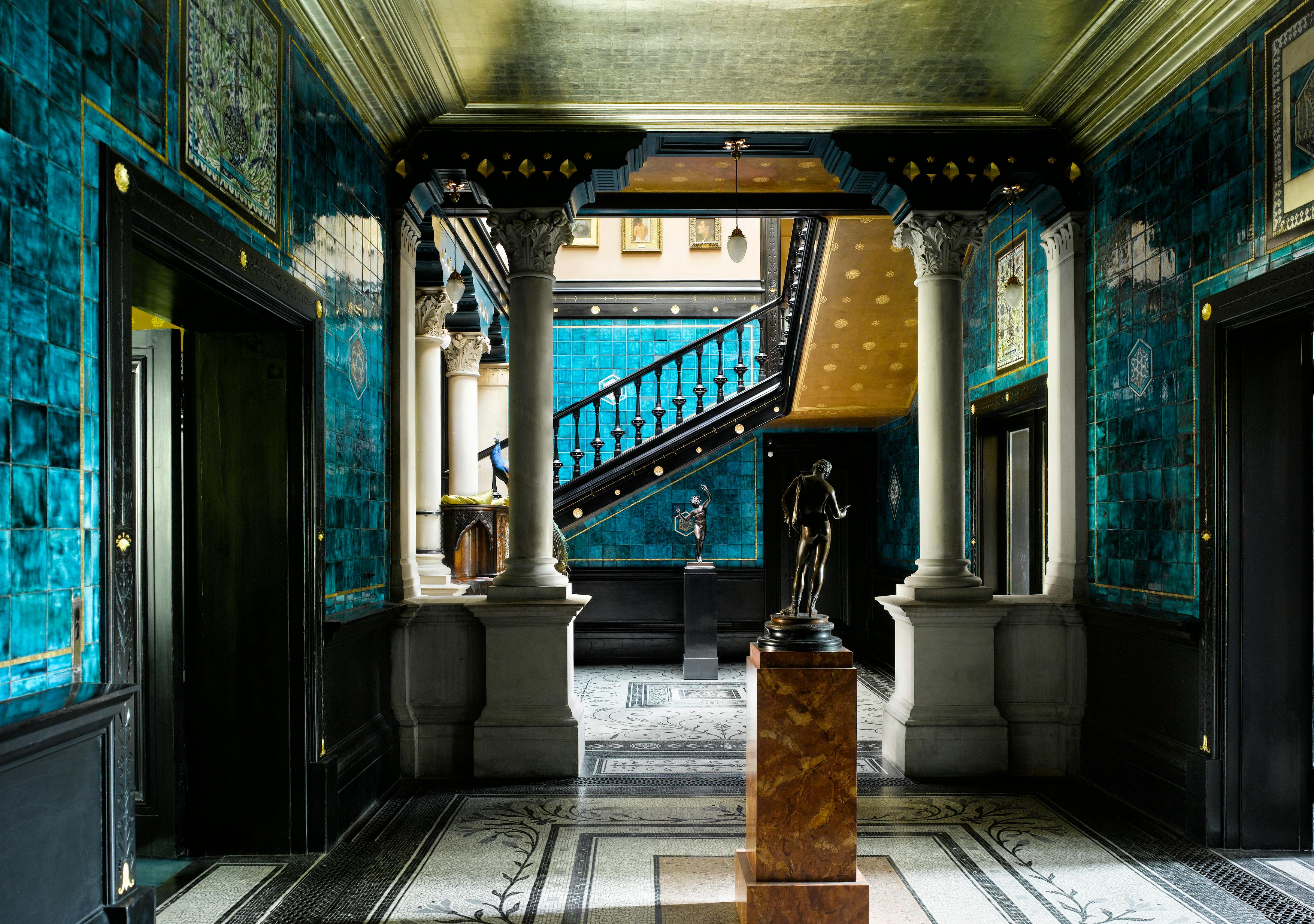 Elegant entryway with turquoise tiles at Leighton House for upscale events.