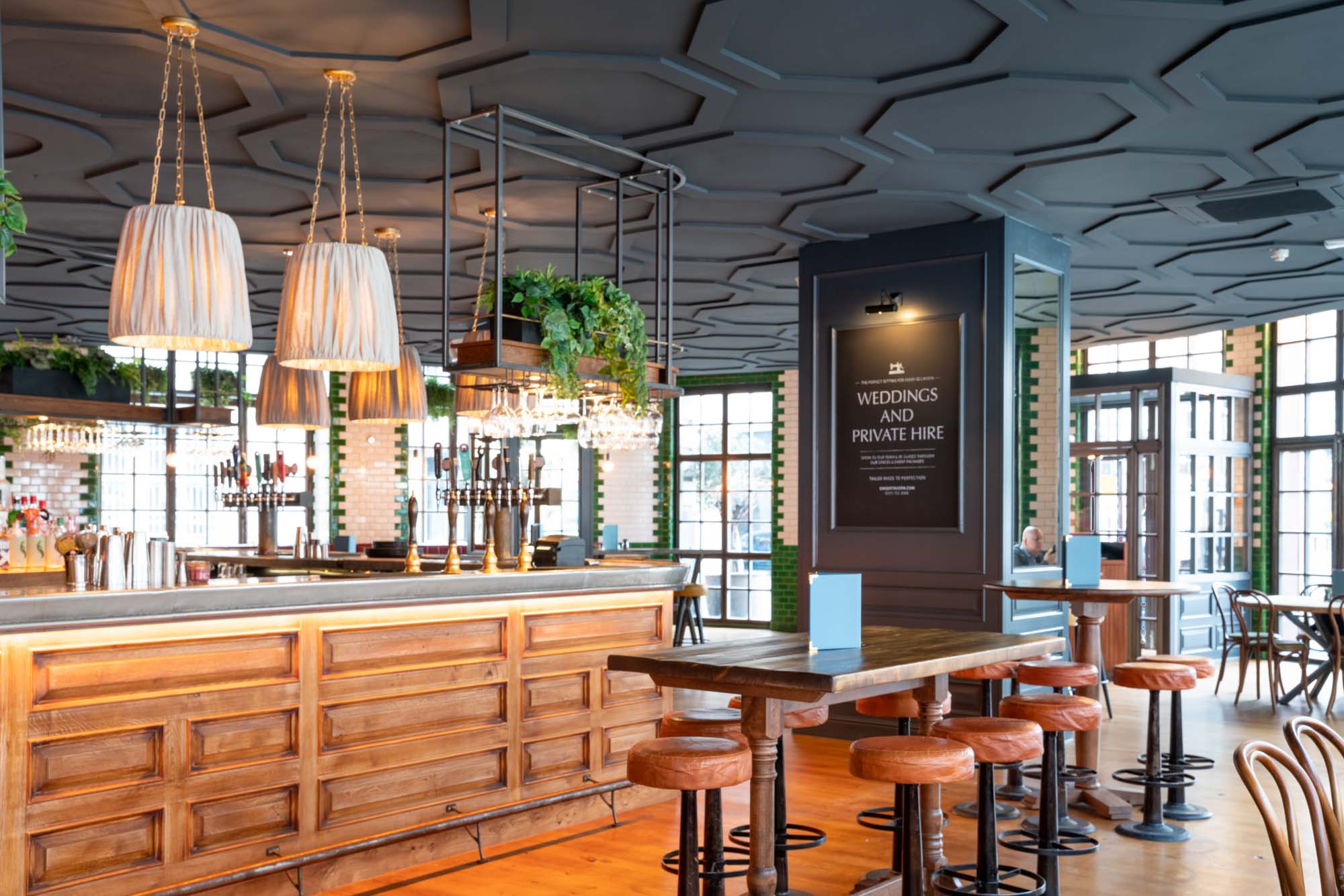 Main Bar in Singer Tavern: modern venue with elegant lighting for weddings and events.