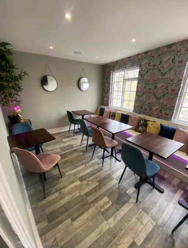 Cozy Railton Lounge venue with colorful chairs for intimate meetings and workshops.