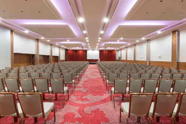 Grand Ballroom at Hotel Okura Amsterdam, elegant conference setup for seminars and presentations.