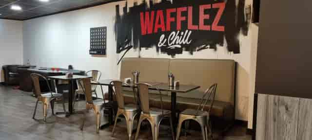 Trendy dining space with industrial chairs, perfect for casual meetings and events.