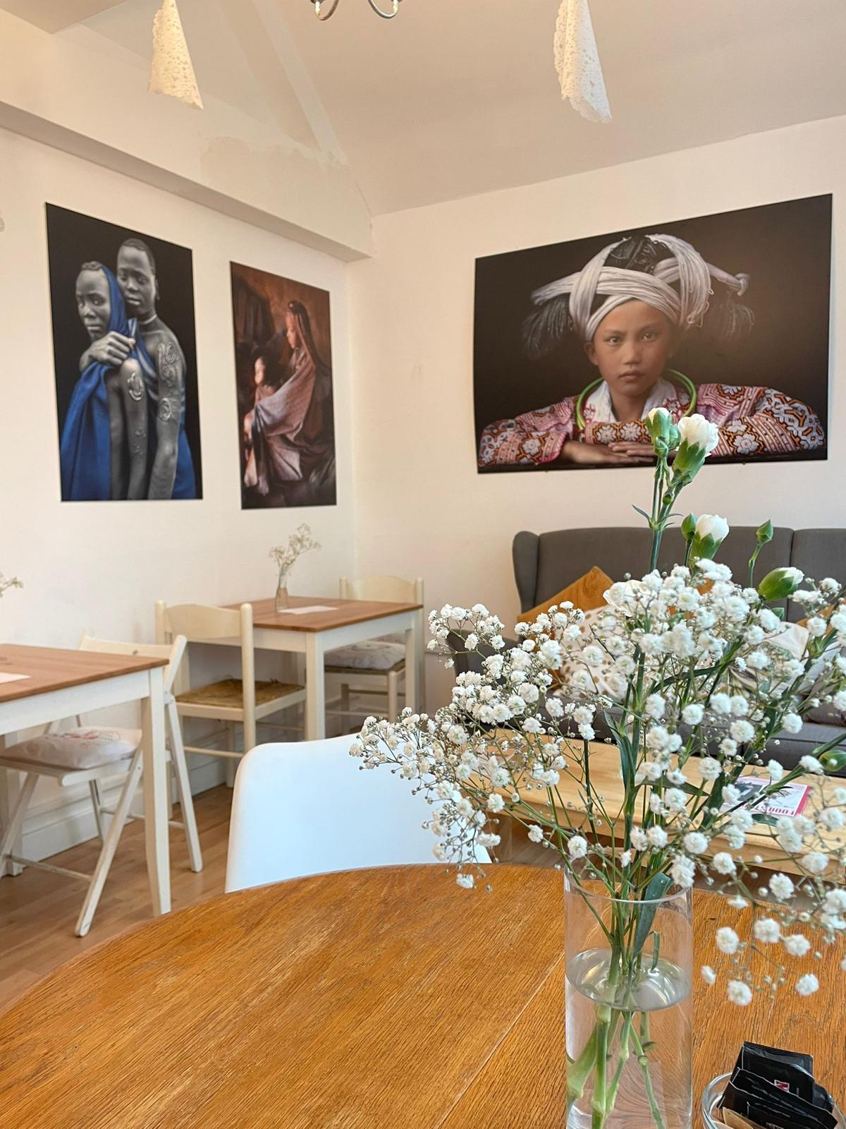 La Nina Caffe' meeting space with impactful artwork for workshops and collaboration.