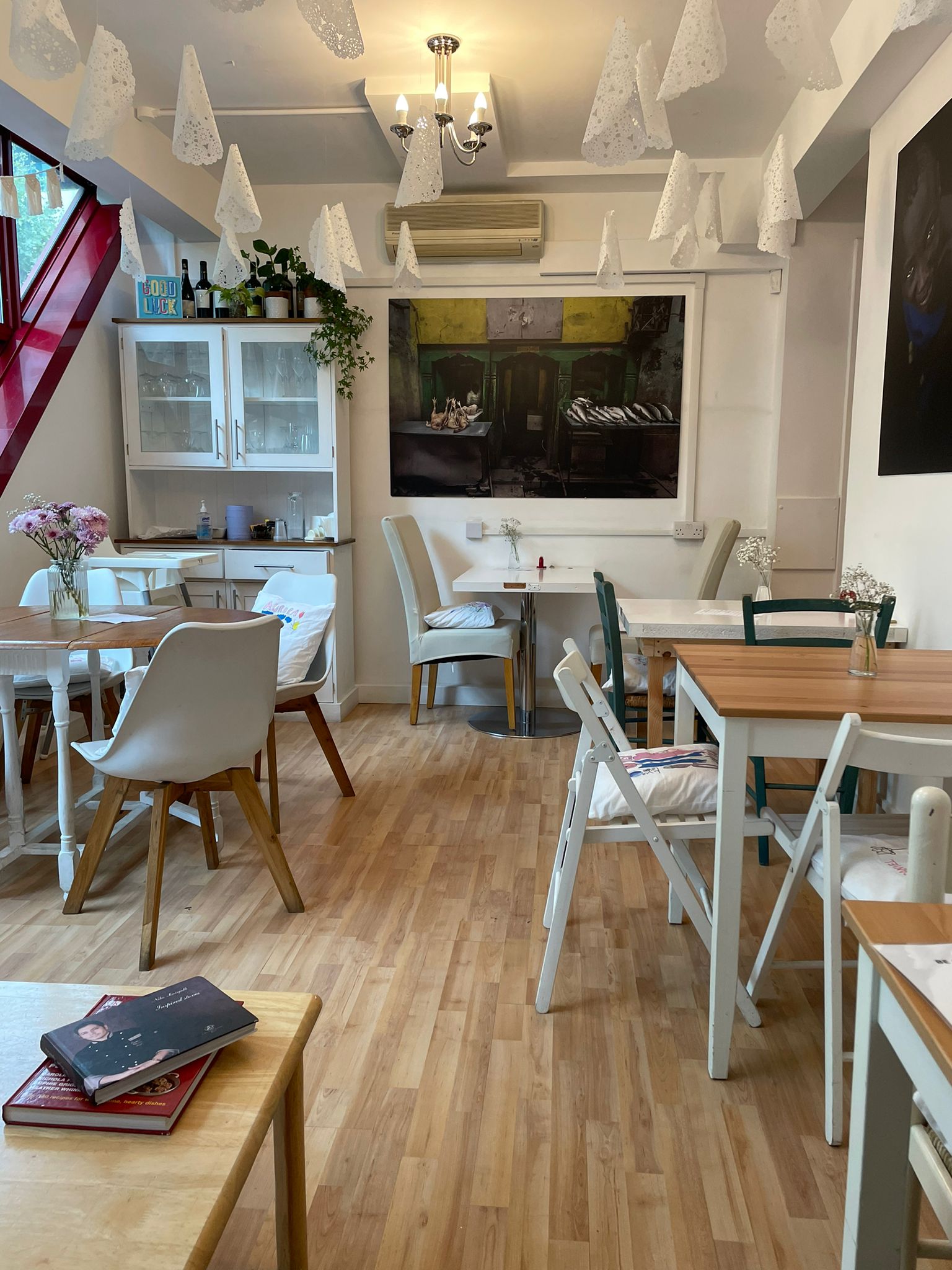 Cozy meeting space at La Nina Caffe' with warm decor, ideal for gatherings and brainstorming.