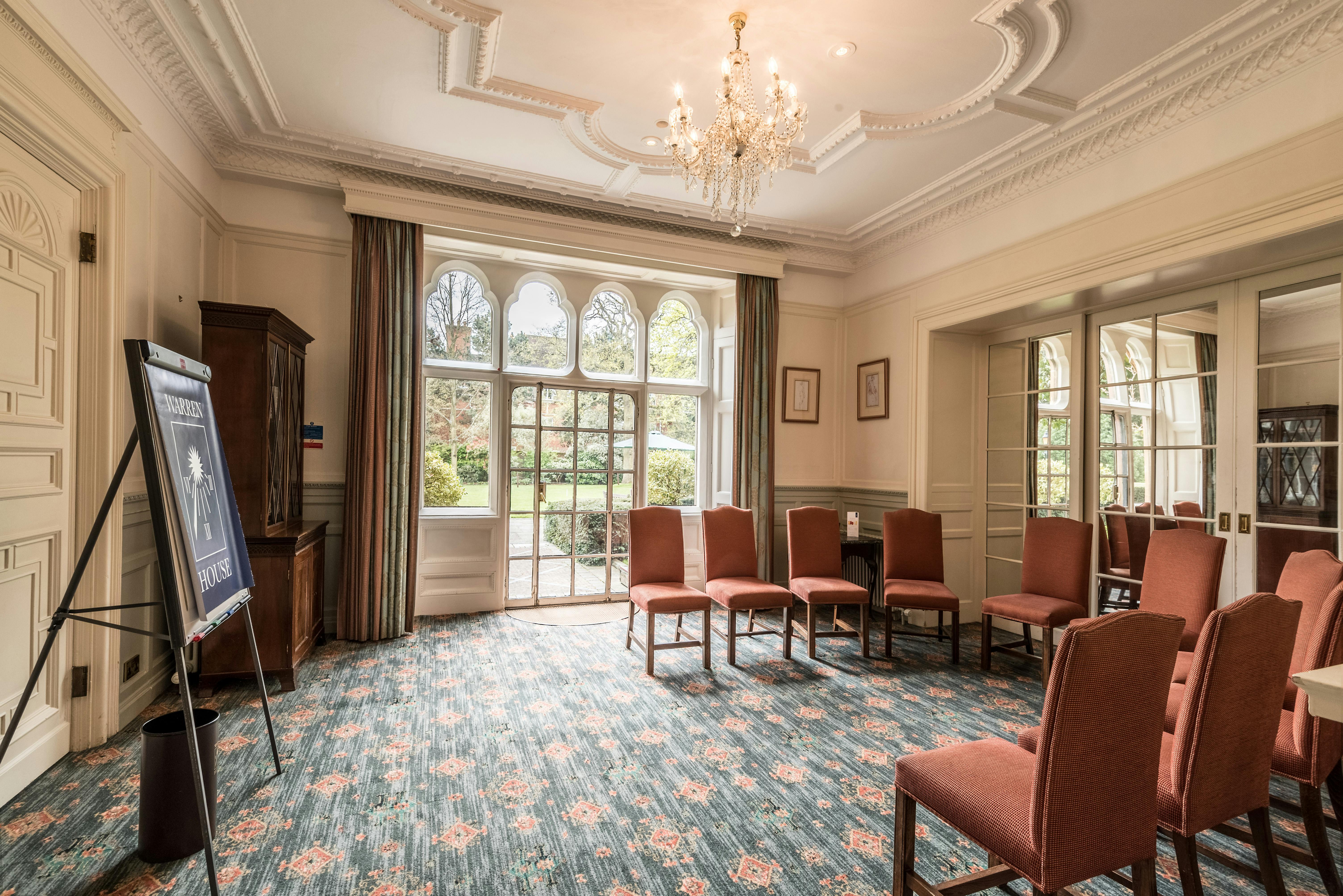 Elegant meeting room with natural light at Warren House Hotel for workshops and discussions.