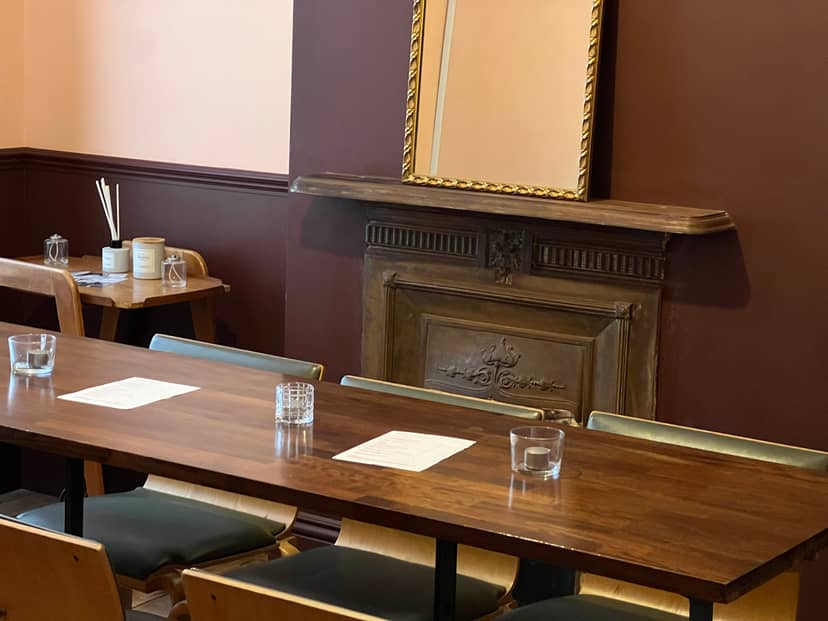 Cozy private dining room with wooden table, perfect for intimate gatherings and meetings.