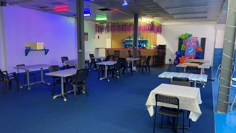 Blue Tick Bar and Grill event space with colorful lighting for celebrations and meetings.