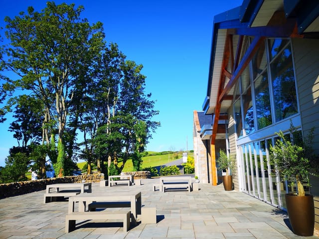 Ceremony Wing at GG's Yard: spacious outdoor venue with sleek seating for receptions.