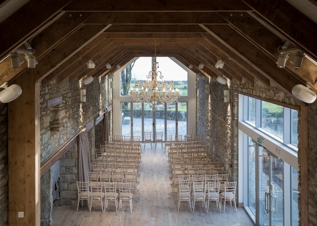 Ceremony Wing in GG's Yard: elegant wedding venue with high ceilings and natural light.