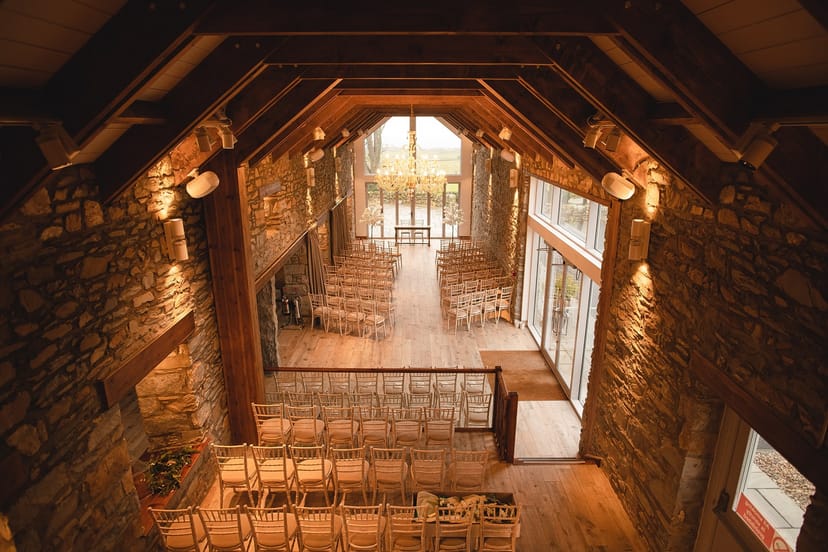 Ceremony Wing in GG's Yard: rustic stone interior, ideal for weddings and events.