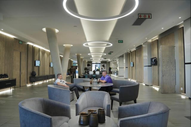 Modern hotel lobby at The Capital On The Park, ideal for meetings and events.
