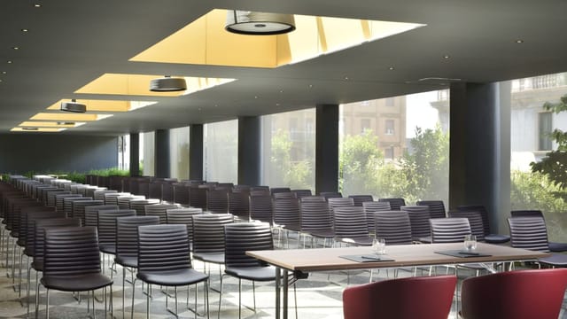 Modern event space with sleek chairs, ideal for meetings and workshops.