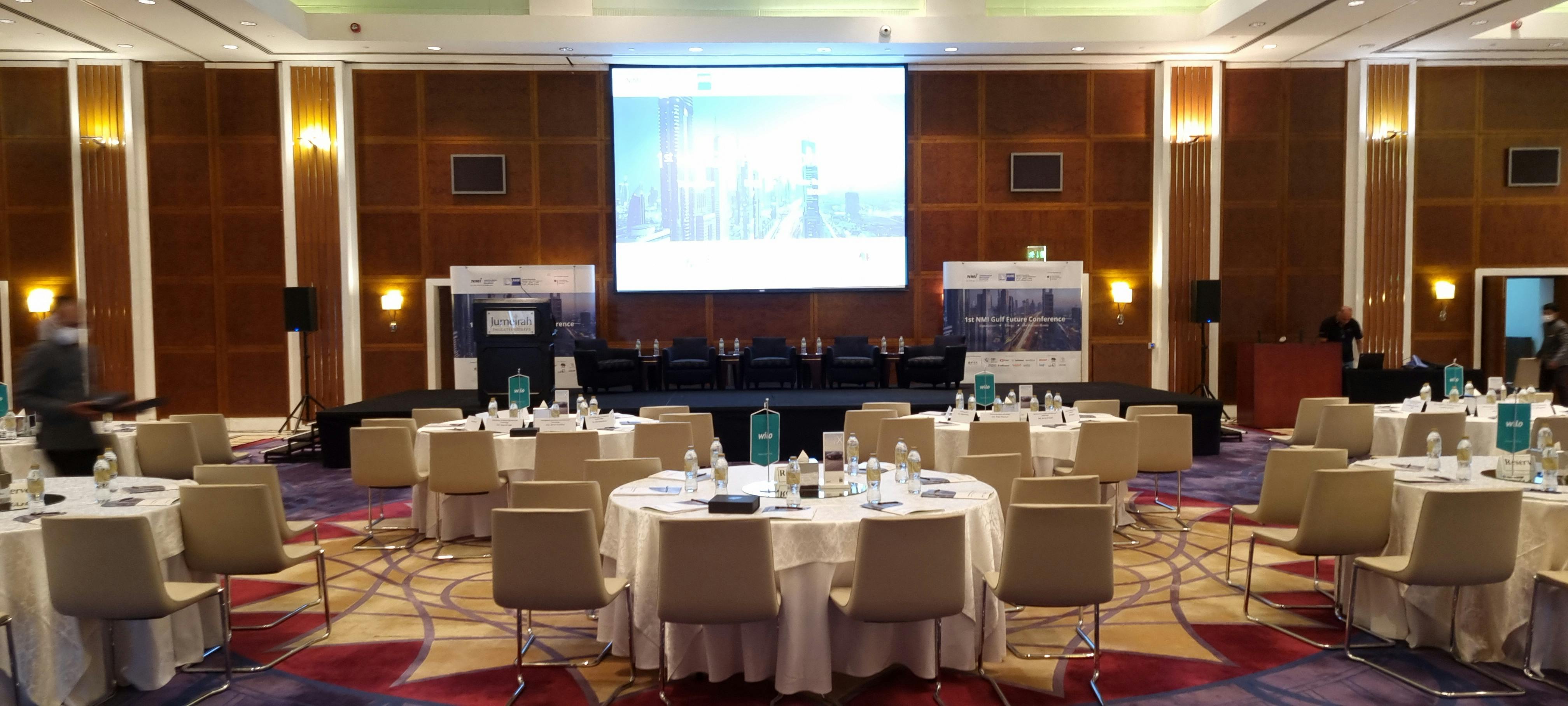 Godolphin Ballroom 1 setup for a professional conference with round tables and AV equipment.
