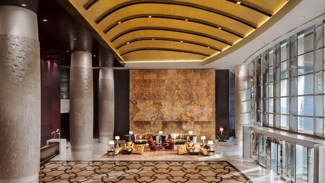Elegant Conrad Dubai Ballroom with high ceilings, ideal for events and networking.