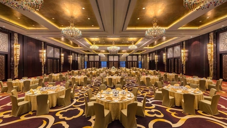 Luxurious banquet hall in Conrad Dubai, ideal for weddings and galas with gold decor.