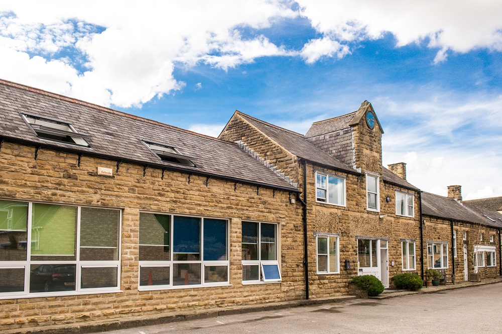 Oasis Centre venue with rustic stone exterior, perfect for events and meetings.