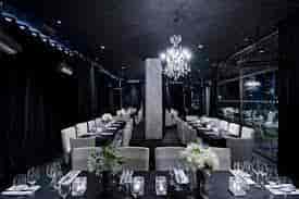 Elegant event space at The O2 with chandelier, perfect for upscale gatherings and meetings.