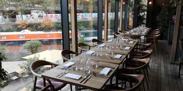Long table dining setup at The Lighterman for corporate events and intimate gatherings.