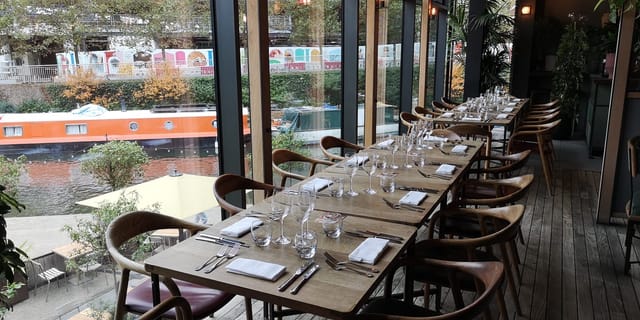 Long table dining setup at The Lighterman, ideal for upscale events and gatherings.