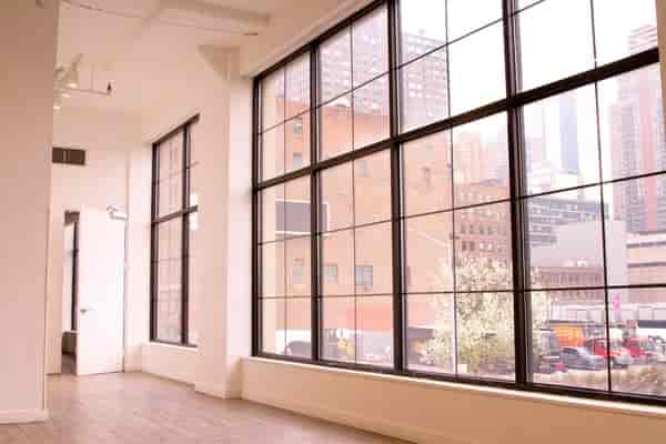Spacious event space with large windows at Clifton Mercantile for meetings and workshops.