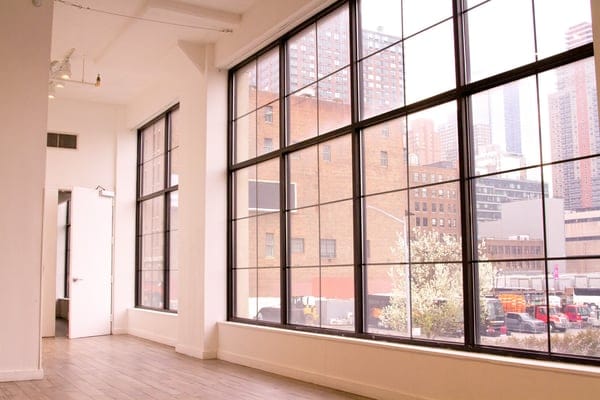 Spacious event space with large windows at Clifton Mercantile for meetings and workshops.