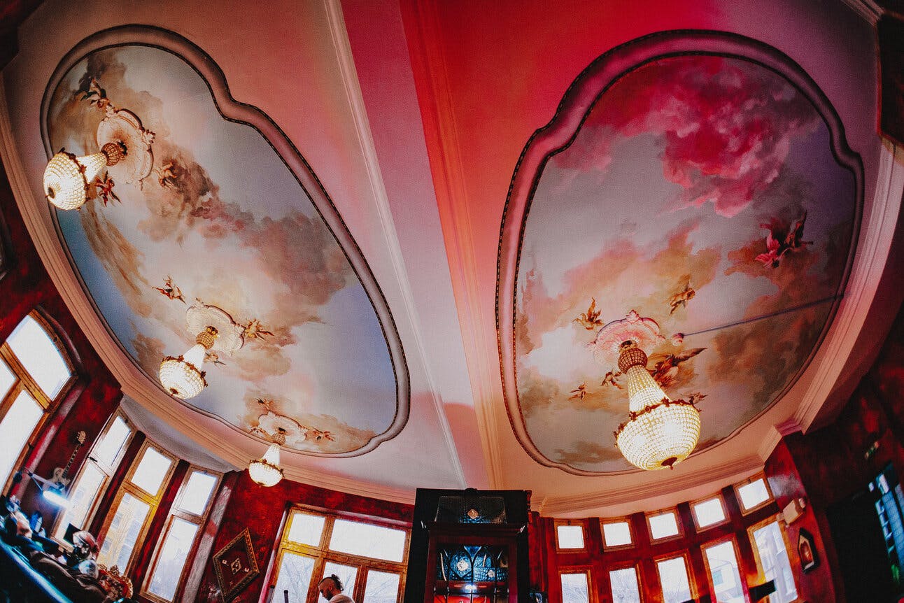 Elegant frescoed ceiling at Sixty Ink, perfect for upscale events and intimate gatherings.