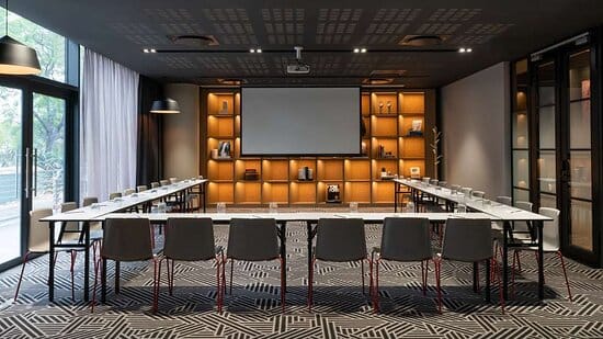 Modern meeting room in Radisson RED, Rosebank with ergonomic chairs for professional events.