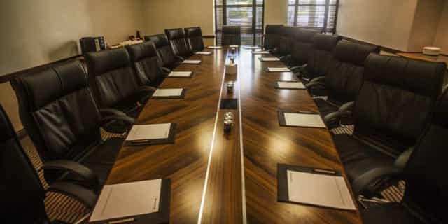 Conference room at Pivot Hotel Montecasino with polished table and leather chairs.